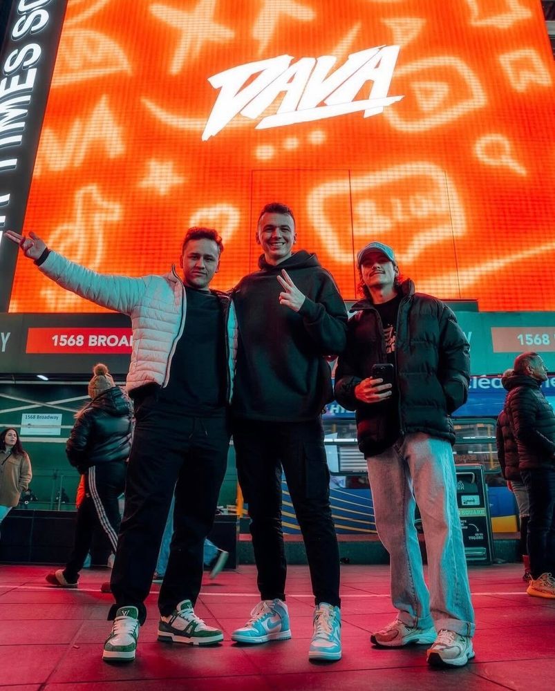 The Dava founders in Times Square under the Dava billboard